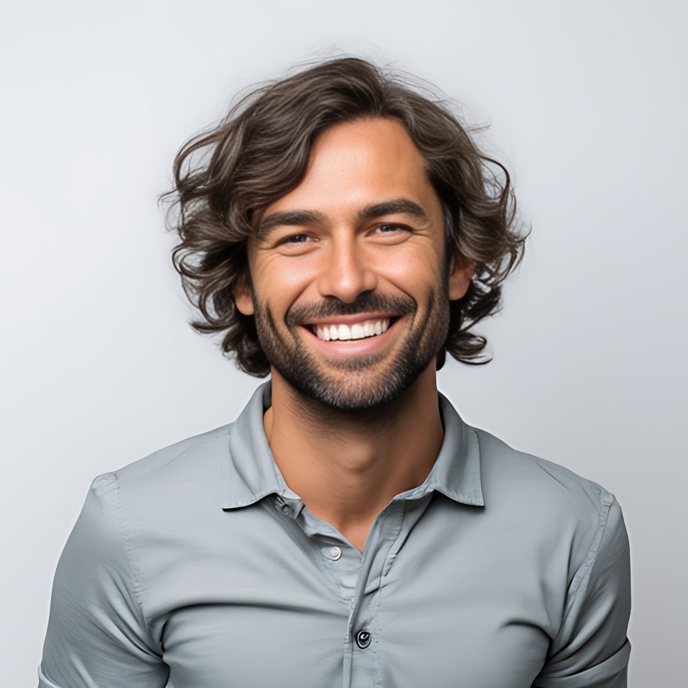 Portrait of Robert Payne, founder of Metadata Marketer, smiling with a computer in the background.